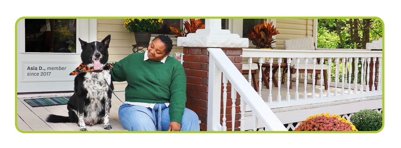 Asia D., Buckeye Member since 2017, sits with her dog on porch