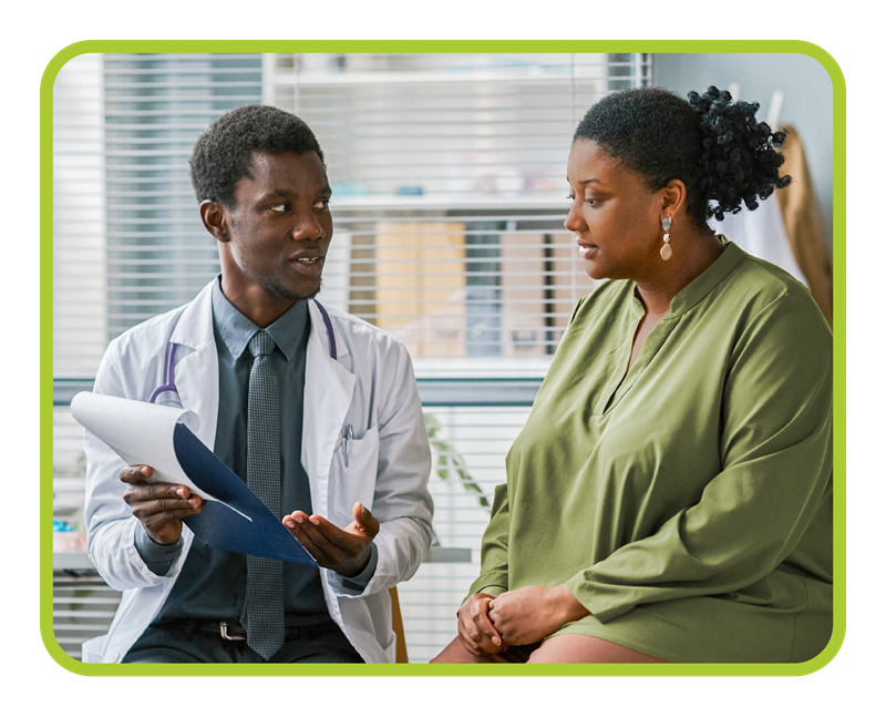 Male doctor talks to female patient