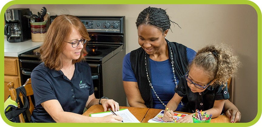 Buckeye staff member helping mom and daughter