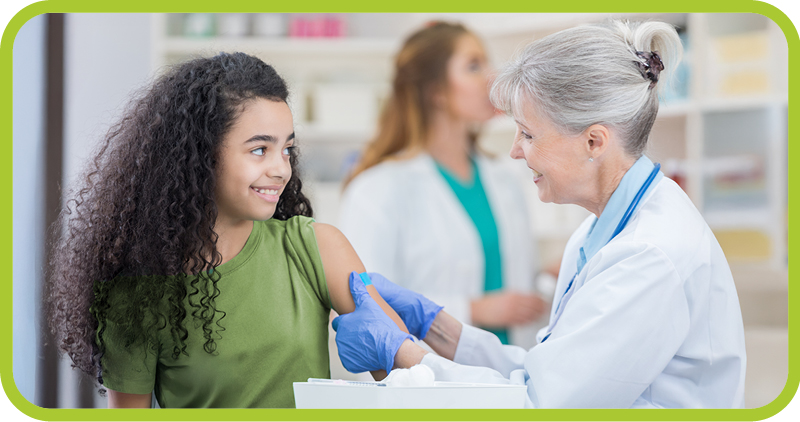 Female doctor treats young female patient. 
