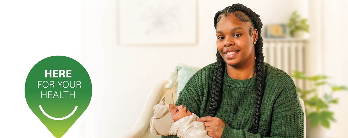 Buckeye is Here for Your Health. A Buckeye member smiles while holdering her baby.