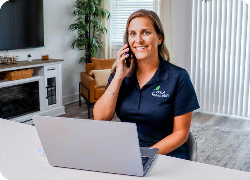 A Buckeye Care Manager talks on the phone in front of her laptop.